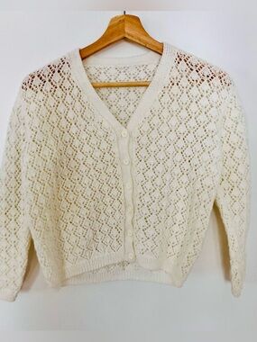 White, crochet style V-Neck Button Cardigan Sweater.